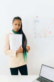 Woman in White Long Sleeve Shirt Holding White Paper